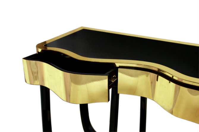 gold console table with black legs